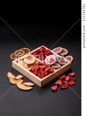 Box of dried fruits strawberries, raspberries, figs and peaches. Dried fruits Box of dried fruits strawberries, raspberries, figs and peaches. Dried fruits 132349701