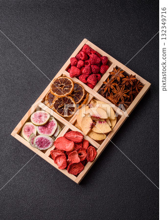 Box of dried fruits strawberries, raspberries, figs and peaches. Dried fruits Box of dried fruits strawberries, raspberries, figs and peaches. Dried fruits 132349716