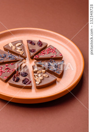 Craft home made chocolate with berries and fruits, delicious sweets. Craft chocolate Craft home made chocolate with berries and fruits, delicious sweets. Craft chocolate 132349728