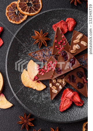 Craft home made chocolate with berries and fruits, delicious sweets. Craft chocolate Craft home made chocolate with berries and fruits, delicious sweets. Craft chocolate 132349739