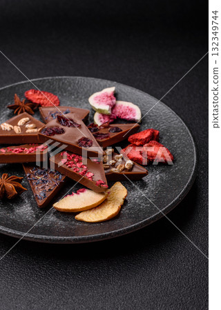 Craft home made chocolate with berries and fruits, delicious sweets. Craft chocolate Craft home made chocolate with berries and fruits, delicious sweets. Craft chocolate 132349744
