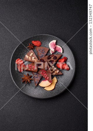Craft home made chocolate with berries and fruits, delicious sweets. Craft chocolate Craft home made chocolate with berries and fruits, delicious sweets. Craft chocolate 132349747