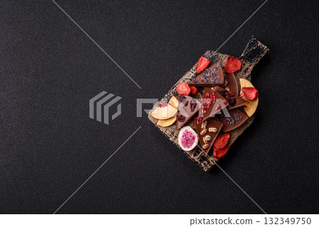 Craft home made chocolate with berries and fruits, delicious sweets. Craft chocolate Craft home made chocolate with berries and fruits, delicious sweets. Craft chocolate 132349750