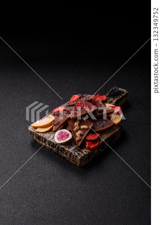 Craft home made chocolate with berries and fruits, delicious sweets. Craft chocolate Craft home made chocolate with berries and fruits, delicious sweets. Craft chocolate 132349752