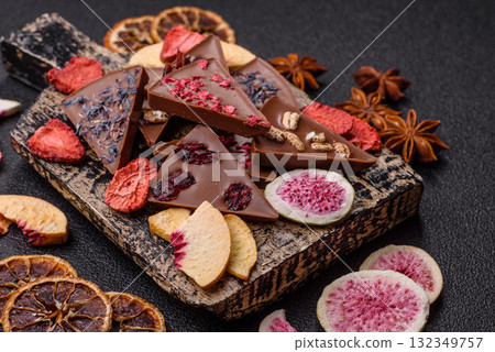 Craft home made chocolate with berries and fruits, delicious sweets. Craft chocolate Craft home made chocolate with berries and fruits, delicious sweets. Craft chocolate 132349757