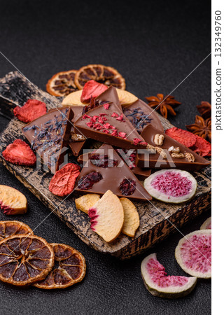 Craft home made chocolate with berries and fruits, delicious sweets. Craft chocolate Craft home made chocolate with berries and fruits, delicious sweets. Craft chocolate 132349760