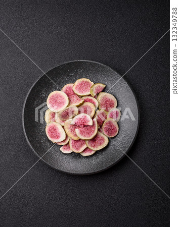 Dried sublimated fig slices as an ingredient for sweet desserts. Dried figs Dried sublimated fig slices as an ingredient for sweet desserts. Dried figs 132349788