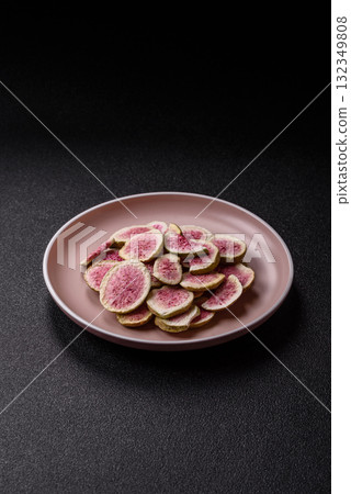 Dried sublimated fig slices as an ingredient for sweet desserts. Dried figs Dried sublimated fig slices as an ingredient for sweet desserts. Dried figs 132349808