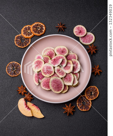 Dried sublimated fig slices as an ingredient for sweet desserts. Dried figs 132349819