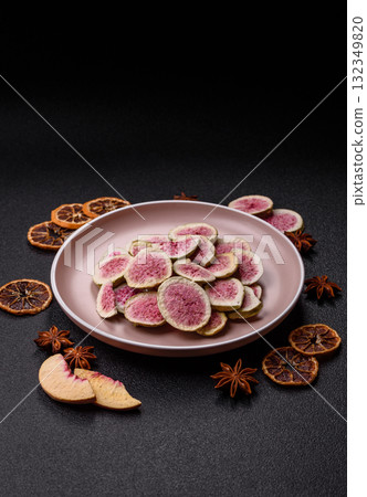 Dried sublimated fig slices as an ingredient for sweet desserts. Dried figs Dried sublimated fig slices as an ingredient for sweet desserts. Dried figs 132349820