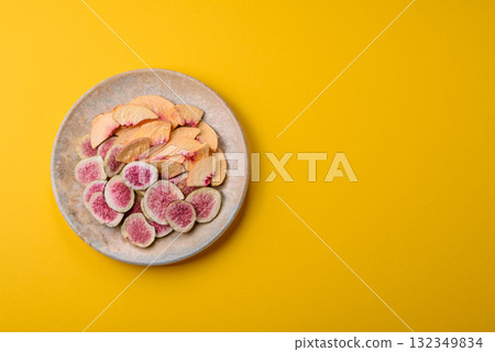 Dried sublimated fig and peach slices as an ingredient for desserts. Dried figs and peaches Dried sublimated fig and peach slices as an ingredient for desserts. Dried figs and peaches 132349834