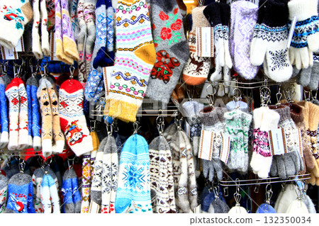 Woolen mittens and socks. Rich choice of winter goods in market Woolen mittens and socks. Rich choice of winter goods in market 132350034