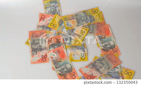 Australian dollar banknotes scattered on white background 132350043