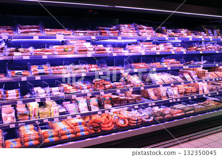 Shop of sausage and meat products. Wide selection of meat products in supermarket 132350045