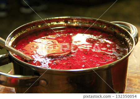 Traditional Ukrainian borscht. Borsch Ukrainian red in pan with scoop 132350054
