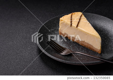 A piece of sweet New York cheesecake, dessert, cheese and vanilla pie. Classic cheesecake A piece of sweet New York cheesecake, dessert, cheese and vanilla pie. Classic cheesecake 132350085