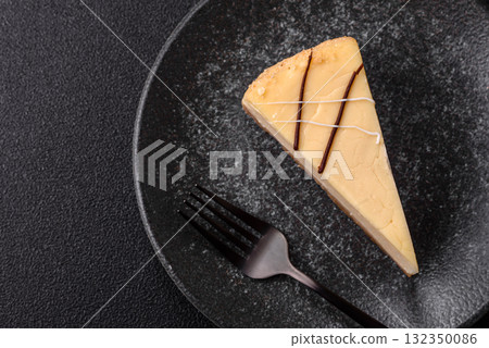 A piece of sweet New York cheesecake, dessert, cheese and vanilla pie. Classic cheesecake A piece of sweet New York cheesecake, dessert, cheese and vanilla pie. Classic cheesecake 132350086