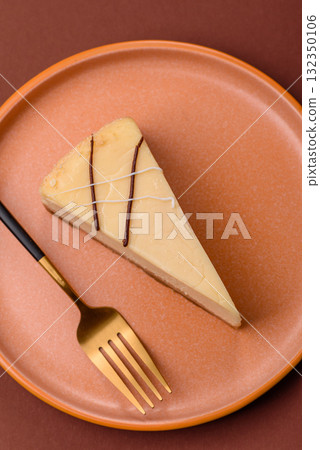 A piece of sweet New York cheesecake, dessert, cheese and vanilla pie. Classic cheesecake A piece of sweet New York cheesecake, dessert, cheese and vanilla pie. Classic cheesecake 132350106