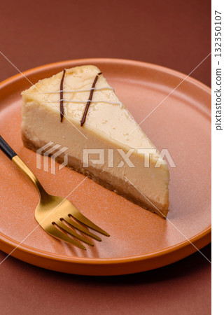 A piece of sweet New York cheesecake, dessert, cheese and vanilla pie. Classic cheesecake A piece of sweet New York cheesecake, dessert, cheese and vanilla pie. Classic cheesecake 132350107