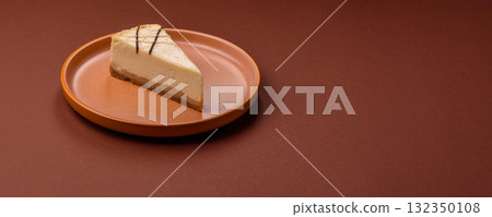 A piece of sweet New York cheesecake, dessert, cheese and vanilla pie. Classic cheesecake A piece of sweet New York cheesecake, dessert, cheese and vanilla pie. Classic cheesecake 132350108
