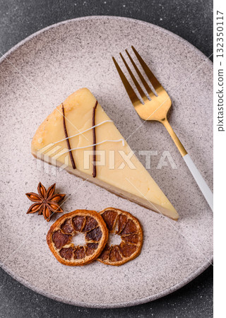 A piece of sweet New York cheesecake, dessert, cheese and vanilla pie. Classic cheesecake A piece of sweet New York cheesecake, dessert, cheese and vanilla pie. Classic cheesecake 132350117
