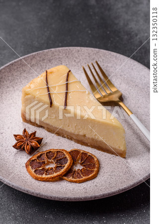 A piece of sweet New York cheesecake, dessert, cheese and vanilla pie. Classic cheesecake A piece of sweet New York cheesecake, dessert, cheese and vanilla pie. Classic cheesecake 132350118