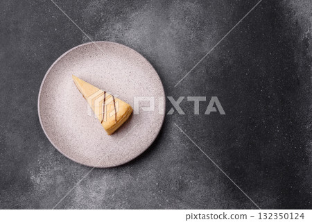 A piece of sweet New York cheesecake, dessert, cheese and vanilla pie. Classic cheesecake A piece of sweet New York cheesecake, dessert, cheese and vanilla pie. Classic cheesecake 132350124