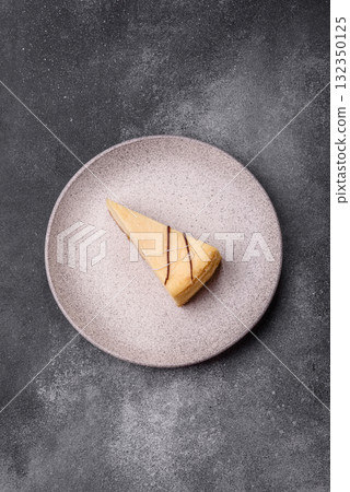 A piece of sweet New York cheesecake, dessert, cheese and vanilla pie. Classic cheesecake 132350125
