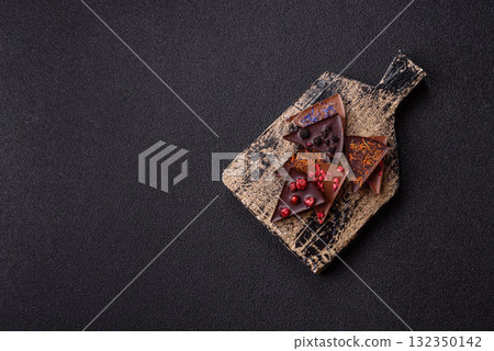 Craft home made chocolate with berries and fruits, delicious sweets. Craft chocolate Craft home made chocolate with berries and fruits, delicious sweets. Craft chocolate 132350142