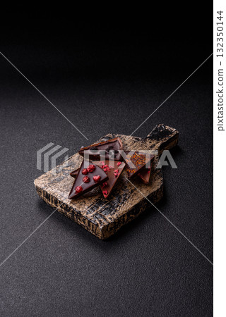 Craft home made chocolate with berries and fruits, delicious sweets. Craft chocolate 132350144