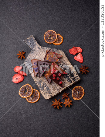 Craft home made chocolate with berries and fruits, delicious sweets. Craft chocolate Craft home made chocolate with berries and fruits, delicious sweets. Craft chocolate 132350152