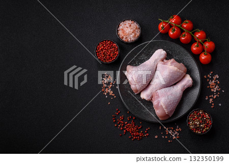 Raw chicken or turkey legs as a food background for cooking on a barbecue or grill. Chicken raw legs 132350199