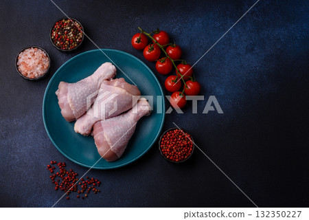Raw chicken or turkey legs as a food background for cooking on a barbecue or grill. Chicken raw legs 132350227