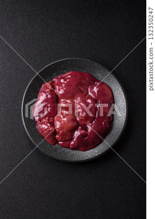 Raw fresh chicken or turkey liver, internal offal of poultry. Raw chicken liver Raw fresh chicken or turkey liver, internal offal of poultry. Raw chicken liver 132350247