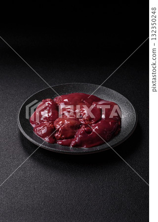 Raw fresh chicken or turkey liver, internal offal of poultry. Raw chicken liver Raw fresh chicken or turkey liver, internal offal of poultry. Raw chicken liver 132350248