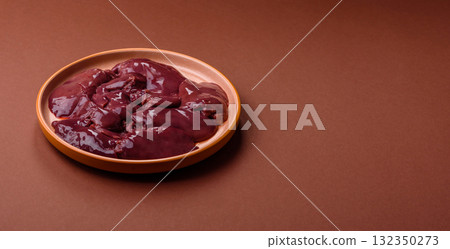 Raw fresh chicken or turkey liver, internal offal of poultry. Raw chicken liver Raw fresh chicken or turkey liver, internal offal of poultry. Raw chicken liver 132350273