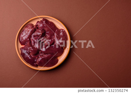 Raw fresh chicken or turkey liver, internal offal of poultry. Raw chicken liver Raw fresh chicken or turkey liver, internal offal of poultry. Raw chicken liver 132350274