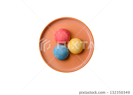 Japanese mochi, ice cream or Asian sweets with fruit filling. Mochi of different colors Japanese mochi, ice cream or Asian sweets with fruit filling. Mochi of different colors 132350349