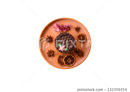 Sweet tart, pie with chocolate and cream with fruit filling on a plate. Chocolate tart Sweet tart, pie with chocolate and cream with fruit filling on a plate. Chocolate tart 132350354