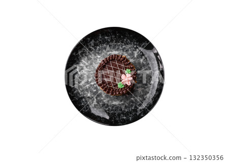 Sweet tart, pie with chocolate and cream with fruit filling on a plate. Chocolate tart 132350356