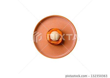 Pie, sweet round tart with apricot pieces, cream and nuts. Sweet tart with peach 132350363