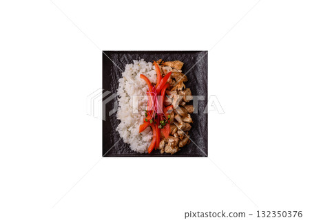 Bowl with chicken pieces, rice, tomatoes, peppers and microgreens. Bowl with chicken 132350376