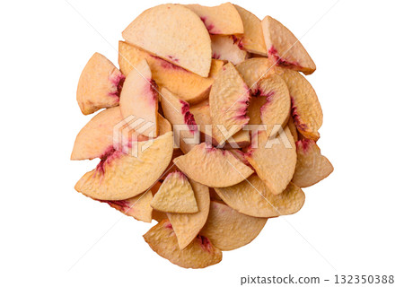 Dried sublimated slices of peach or apricot as an ingredient for sweet desserts. Dried peach 132350388