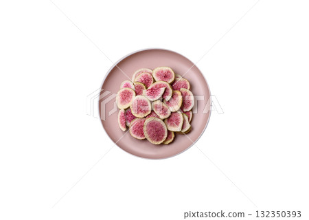Dried sublimated fig slices as an ingredient for sweet desserts. Dried figs Dried sublimated fig slices as an ingredient for sweet desserts. Dried figs 132350393