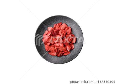 Dried sublimated slices of strawberry as an ingredient for sweet desserts. Dried strawberry 132350395
