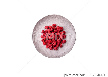 Dried sublimated slices of raspberry as an ingredient for sweet desserts. Dried raspberry 132350401