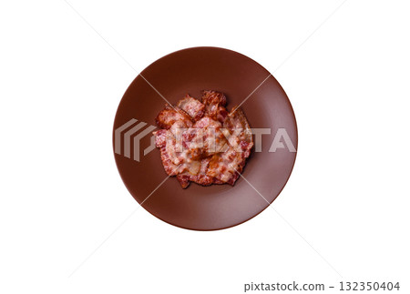 Cooked crispy fried pork bacon strips for a hearty breakfast. Fried bacon strips 132350404