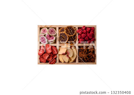 Box of dried fruits strawberries, raspberries, figs and peaches. Dried fruits Box of dried fruits strawberries, raspberries, figs and peaches. Dried fruits 132350408
