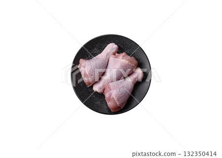 Raw chicken or turkey legs as a food background for cooking on a barbecue or grill. Chicken raw legs Raw chicken or turkey legs as a food background for cooking on a barbecue or grill. Chicken raw legs 132350414