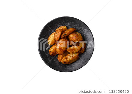 Potato wedges baked with spices, garlic and rosemary. Potato wedges Potato wedges baked with spices, garlic and rosemary. Potato wedges 132350430
